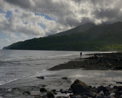 On the way to La Soufriere volcano. First, we go through the black sand beach between the Caribbean Sea and the jungle. Away from the volcano gravitate to us heavy clouds. We cross the bright streams.