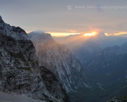 Last beam comming through the gap over the peaks of Julian Alps