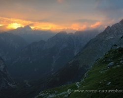 A short moment of sun shine going between the peaks and rainy clouds